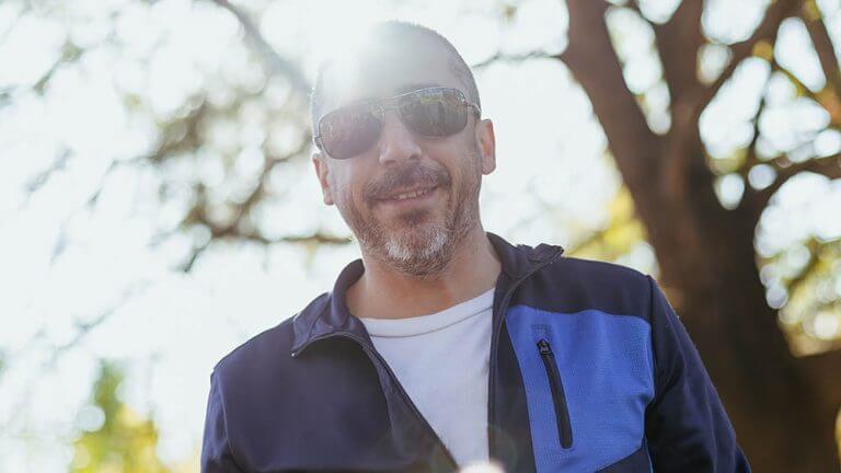 40-year-old,Man,With,Gray,Hair,,Beard,,Sunglasses,,Looking,At,The